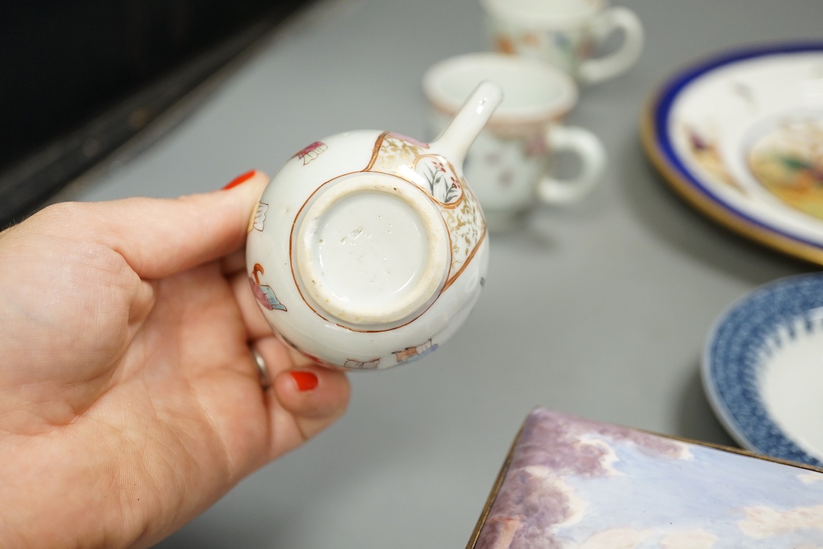 A 19th century enamel on copper trinket box, depicting a shipping fleet, together with a Chamberlain’s Worcester bird plate, a Royal Worcester coffee cup, a Meissen tea cup and three Chinese export cups (9)